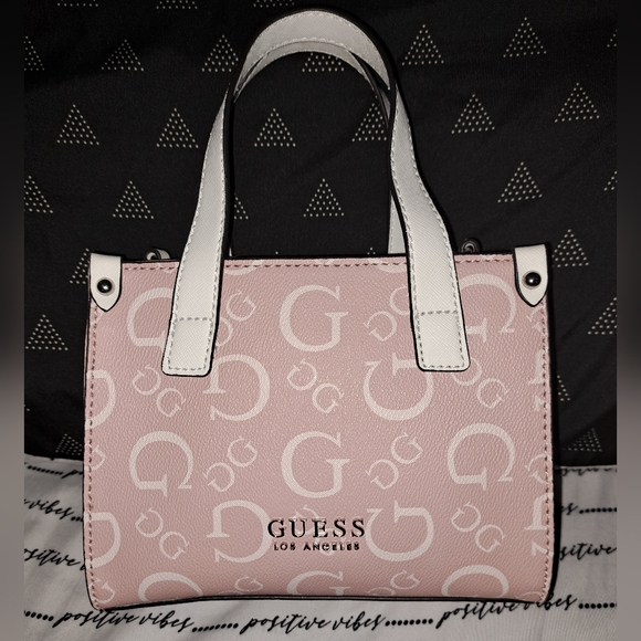Guess Handbags - NWT Pink and white Guess crossbody purse